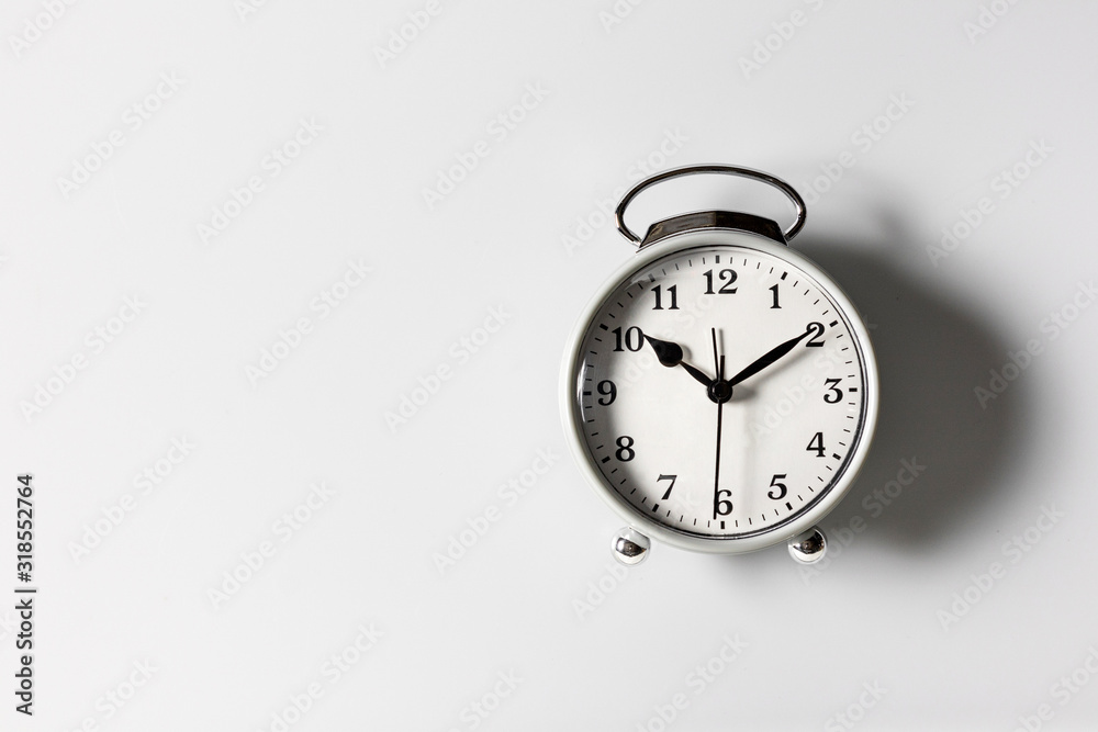 A white alarm clock on a white background A white alarm clock on a white background