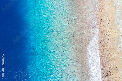 Sea ocean aerial view, top view, amazing marine nature background. Reef and coastal view, shades of blue
