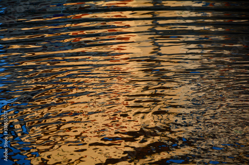 Golden rippled water surface