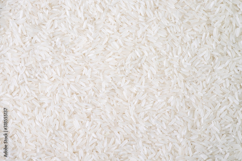 Top view of white rice seed texture background. Organic, natural long rice grain, food for healthy. Agriculture of culture asian. Flay lay
