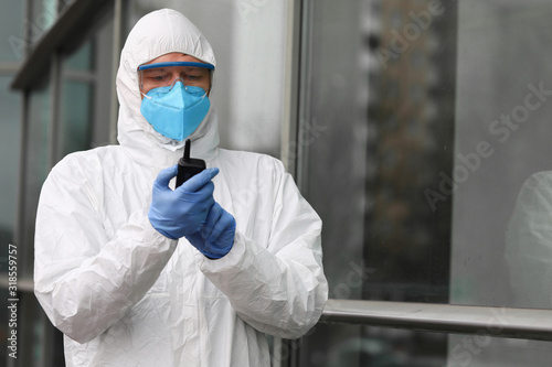 Male virologist hold infection source detector portrait. Chinese corona virus concept