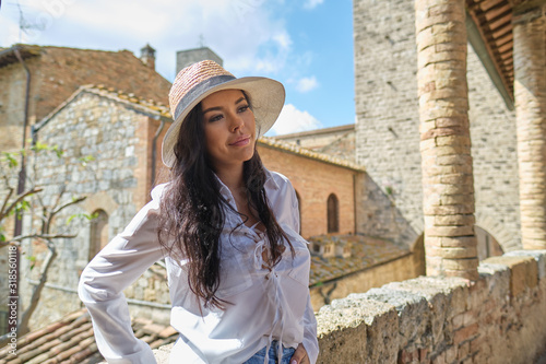 attractive woman tourist with hat in old italian town © ZoomTeam