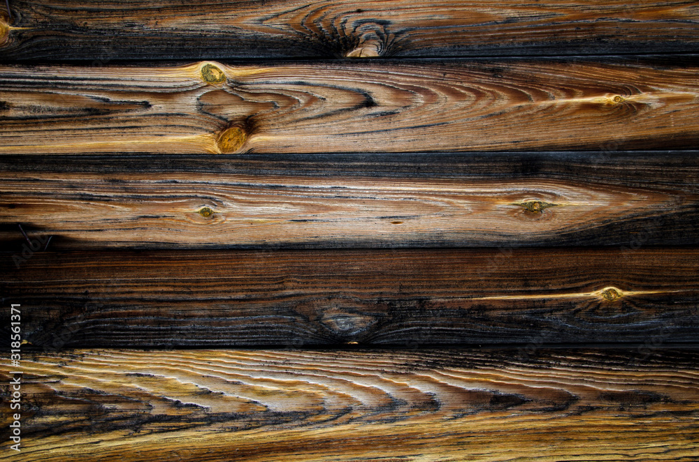 Naklejka premium Old pine horizontal boards. The wood texture is brown-yellow with rings and traces of knots. Wooden abstract background, structure.