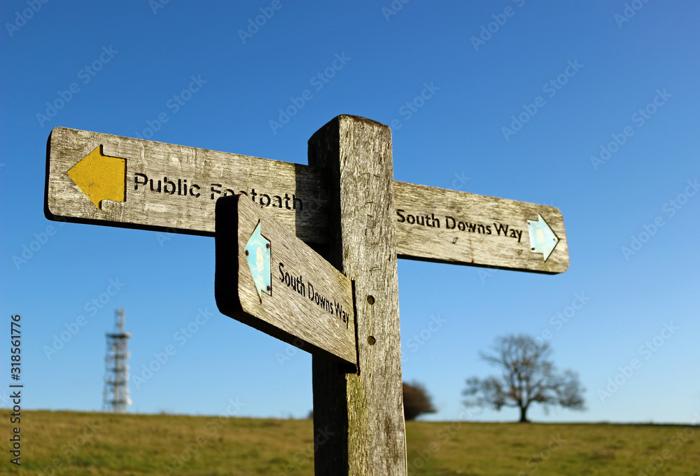 A wooden signpost to the South Downs Way at Butser Hill in Hampshire, England
