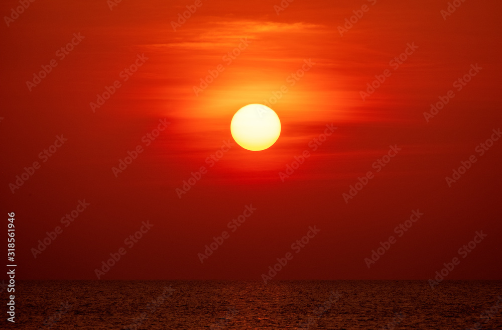 big sun and ocean orange sunset