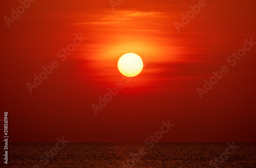 Fototapeta Naklejka Na Ścianę i Meble -  big sun and ocean orange sunset