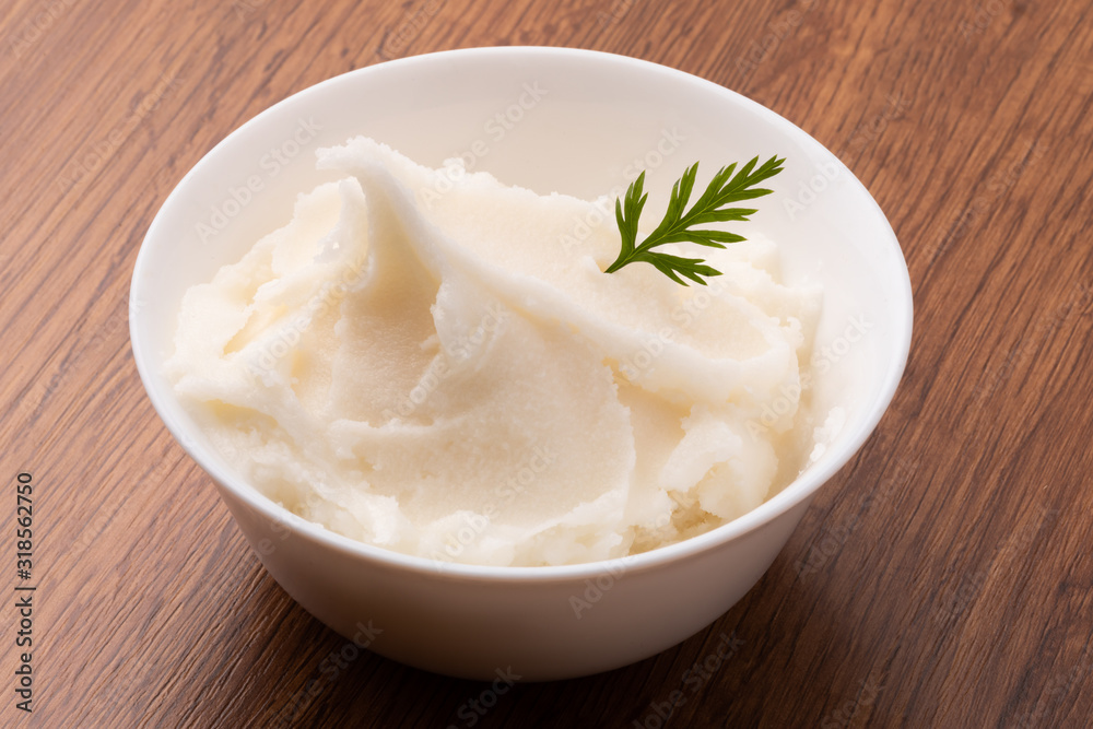small bowl of lard on wooden table small bowl of lard on wooden table