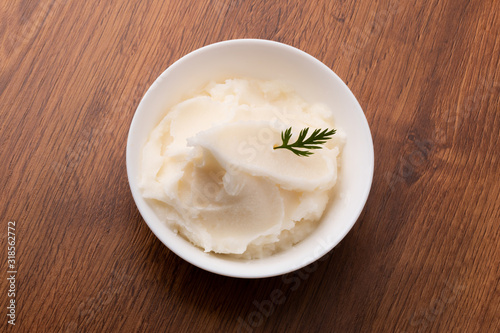 small bowl of lard on wooden table