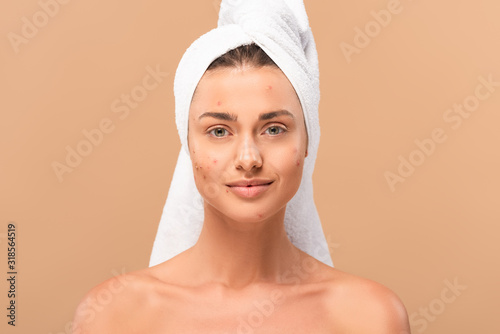 Canvas Print happy nude girl in towel looking at camera isolated on beige