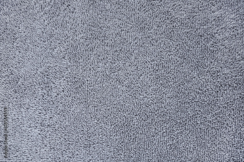Texture of a gray towel made of natural cotton. Close-up photo.