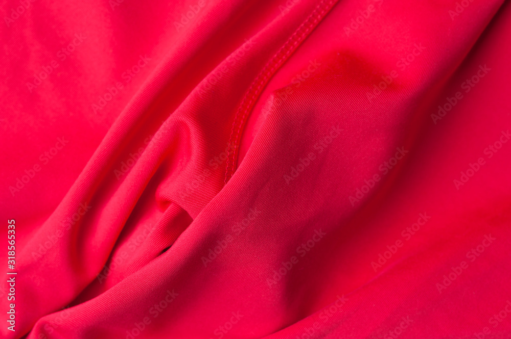 Obraz premium Fragment of crumpled red polyester fabric