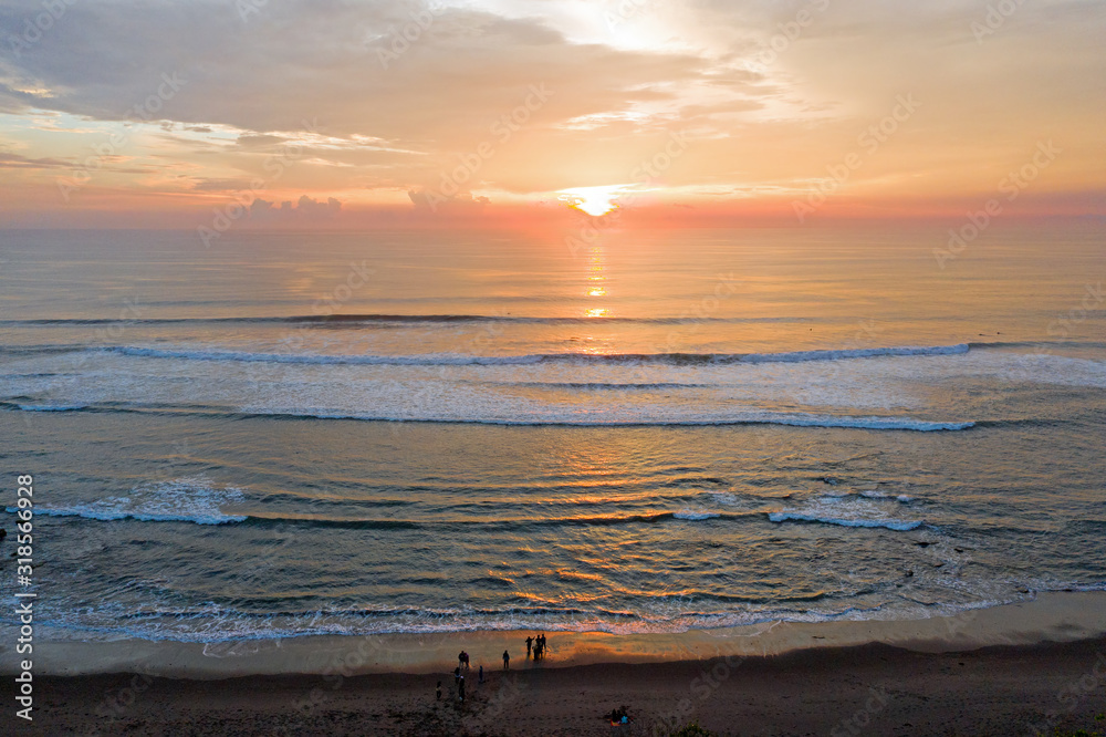 Aerial from a beautiful sunset at the west coast on Bali Indonesia