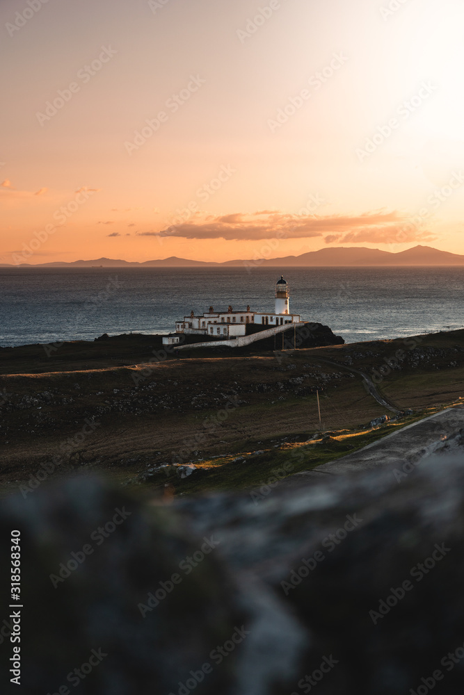 Neist point lighthouse during sunset in spring