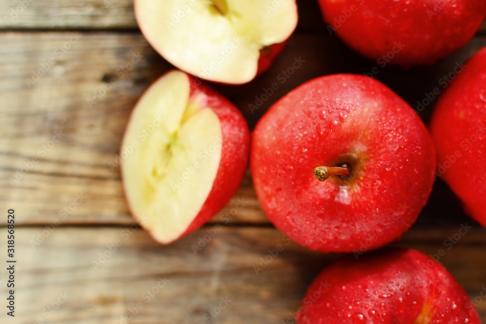Red apples on a wooden background. Healthy ripe fruits, raw food diet, vegetarian. Red apples on a wooden background. Healthy ripe fruits, raw food diet, vegetarian.