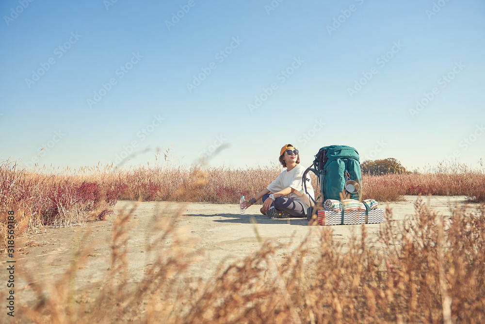Korean woman is backpacking on an island in Korea. Korean woman is backpacking on an island in Korea.