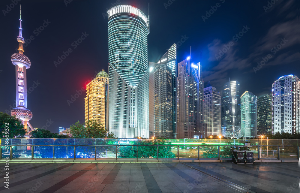 At night, footbridges and skyscrapers in Shanghai, China
