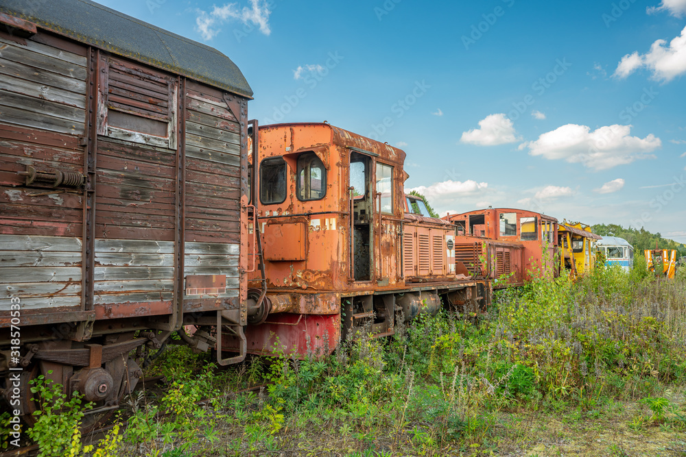 Old abandoned train overgrown by vegetation Old abandoned train overgrown by vegetation