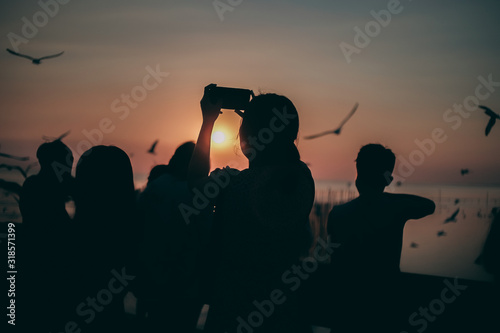 Silhouette of the sea on sunset background of the sky