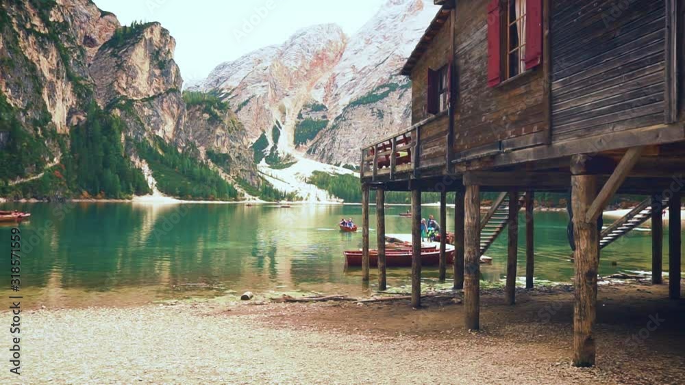 mysterious wooden house on legs stands high above ground in flow