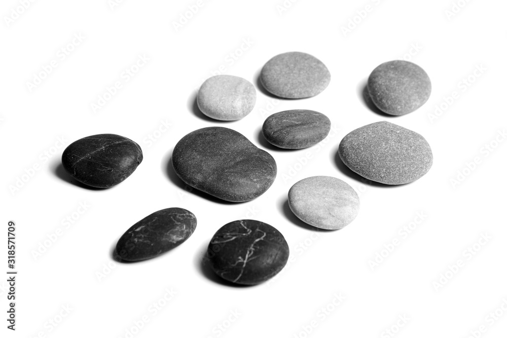 Pebbles, black and gray color smooth sea stones isolated on white background Pebbles, black and gray color smooth sea stones isolated on white background