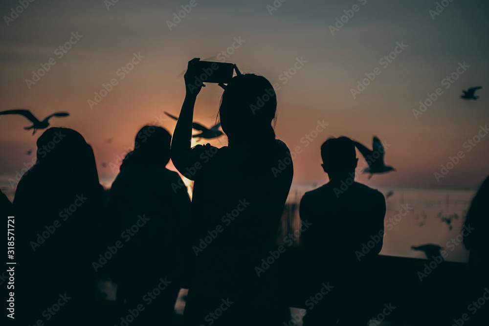 Fototapeta premium Silhouette of the sea on sunset background of the sky