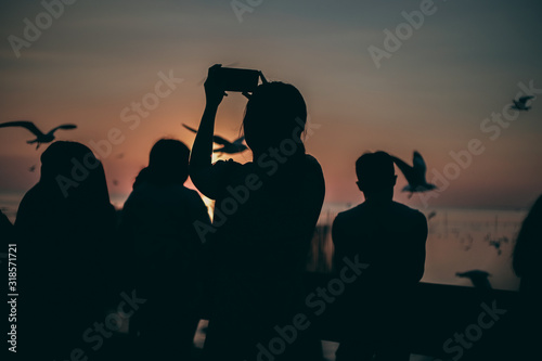 Silhouette of the sea on sunset background of the sky