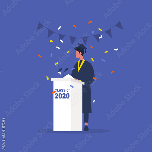 Class of 2020, Graduated male student in a gown standing behind a tribune