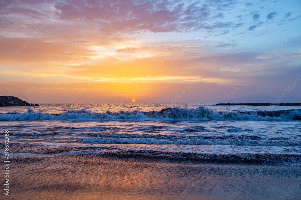 beautiful sunset on the sea and sand beach 