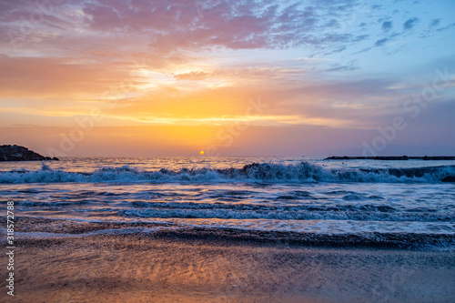 beautiful sunset on the sea and sand beach 