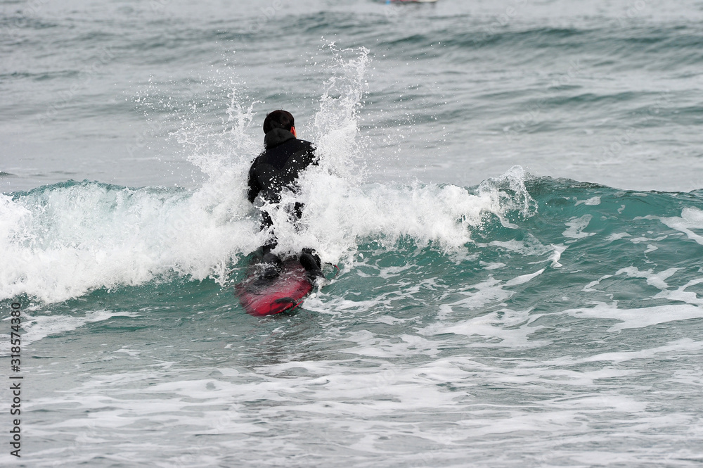 Korean Winter surfers at the Buheung-ri beach in Namjeong-Myeon, Yeongdeok-gun, South Korea. Korean Winter surfers at the Buheung-ri beach in Namjeong-Myeon, Yeongdeok-gun, South Korea.