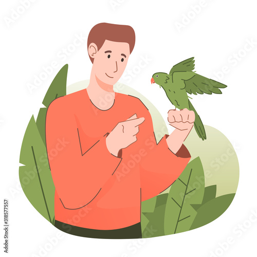 Young man with parakeet. People and pet concept