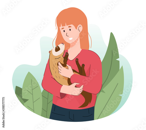 Woman holding ferret. Happy people having fun with their pet