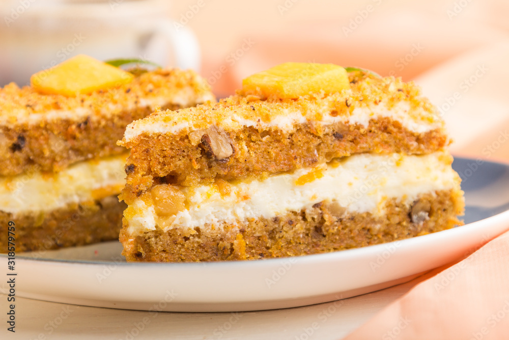 Homemade cake with persimmon and pumpkin and a cup of coffee on a white wooden background with orange textile. side view, selective focus. Homemade cake with persimmon and pumpkin and a cup of coffee on a white wooden background with orange textile. side view, selective focus.