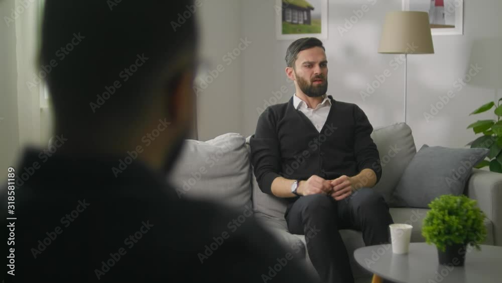 Young man at a session with a psychologist
