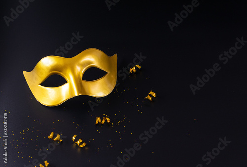 Golden carnival mask with copy space. Carnival, Mardigras, or Brazilian carnival concept.
