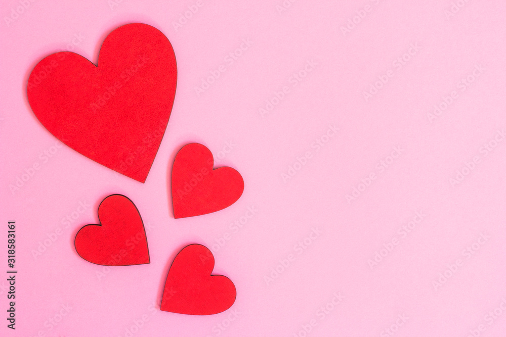 valentines day composition with red hearts on pink background