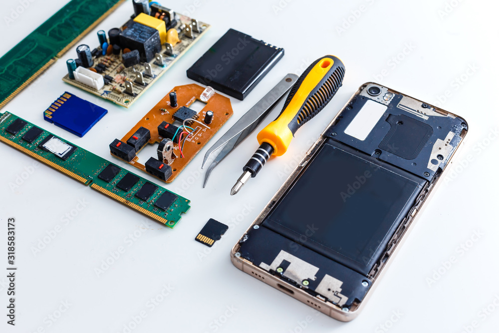 Close-up photos of mobile phones in a repair atelier. Close-up photos of mobile phones in a repair atelier.