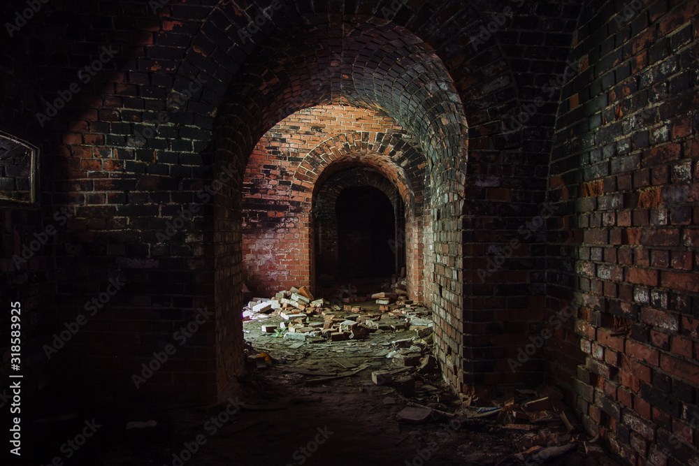 Fototapeta premium Dark corridor in old abandoned German fortification