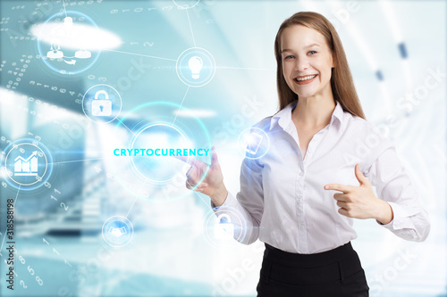 Business, Technology, Internet and network concept. Young businessman working on a virtual screen of the future and sees the inscription: Cryptocurrency