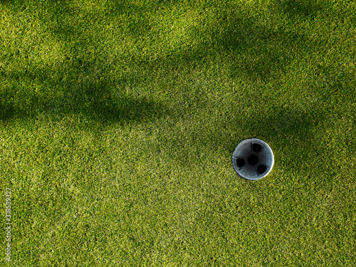 Golf hole with tree shadows