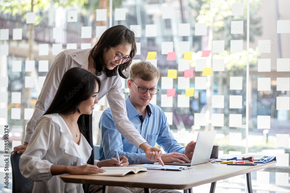 Group of young modern people in smart casual wear at meeting together to analyze and discussing business in the office. Group of young modern people in smart casual wear at meeting together to analyze and discussing business in the office.