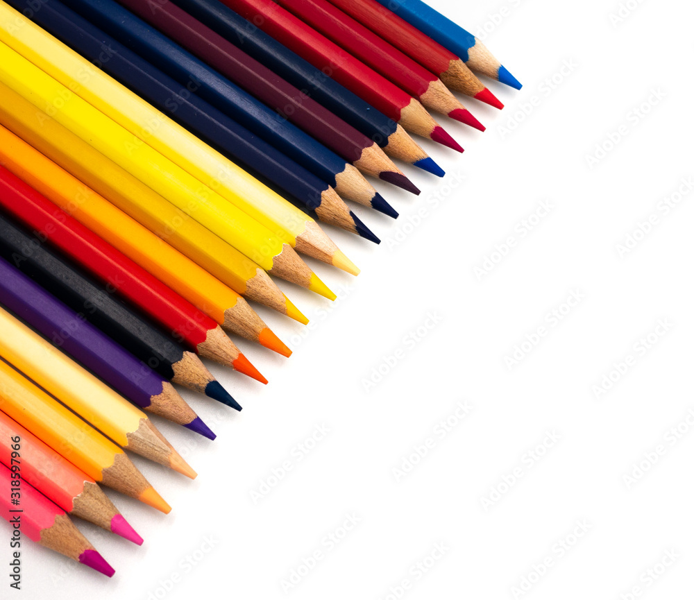 Colored pencils placed on a white background