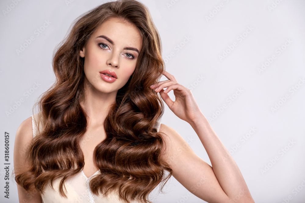 Portrait of a beautiful woman with a long brown hair. - obrazy, fototapety, plakaty 