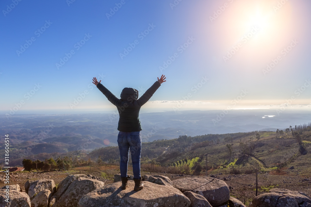 Girl woman reached the peak of the peak, admires the success, and the sun. Monchique, Foia, Portugal. Girl woman reached the peak of the peak, admires the success, and the sun. Monchique, Foia, Portugal.