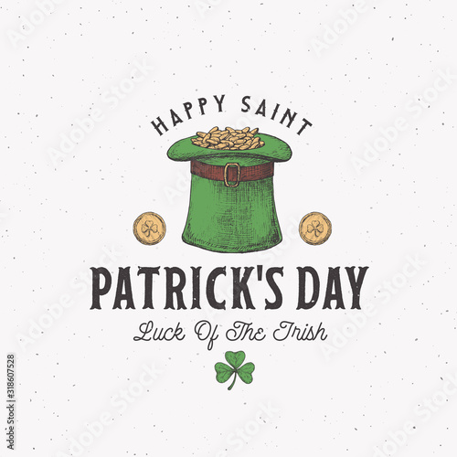 Vintage Style Saint Patricks Day Logo or Label Template. Hand Drawn Leprechauns Hat Full of Gold Coins and Shamrock Leaf Sketch Symbols with Retro Typography. Shabby Texture Background.
