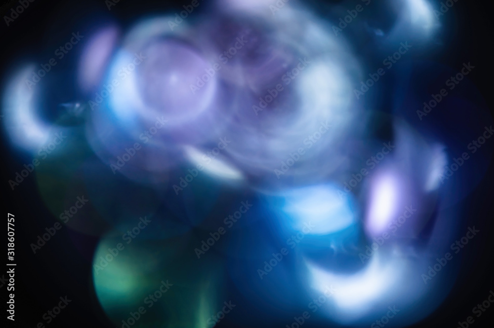 Blue abstract blurred shiny glitter lamp lights background.