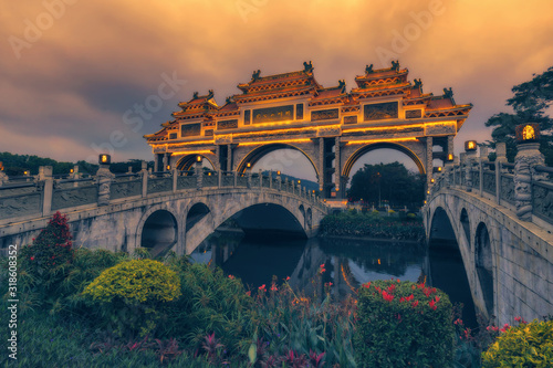 Shunfengshan Park, located at the foot of Taiping Mountain in Shunde District, Foshan City, Guangdong, China. A paifang is a traditional style of Chinese architectural arch or gateway structure.  photo