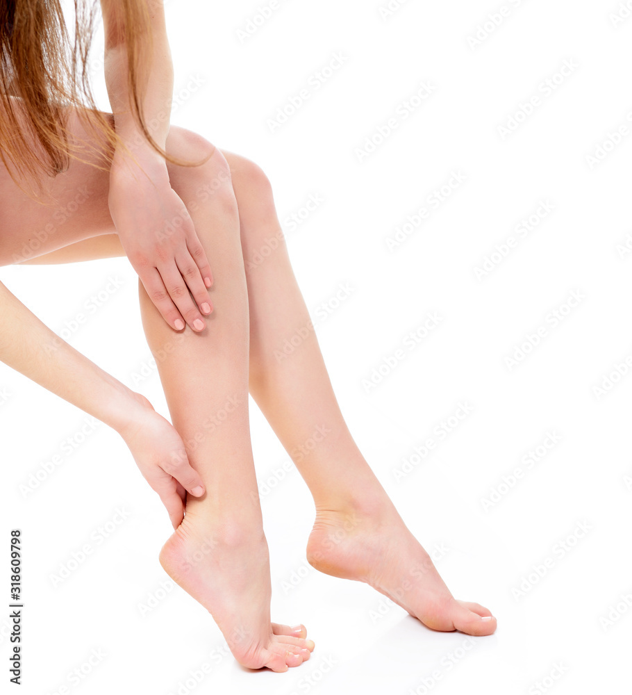 beautiful graceful female legs of young woman over white background beautiful graceful female legs of young woman over white background