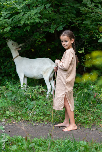 Εκτύπωση καμβά Little girl goatherd in forest