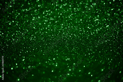 Green Sparkling Lights Festive background with texture.